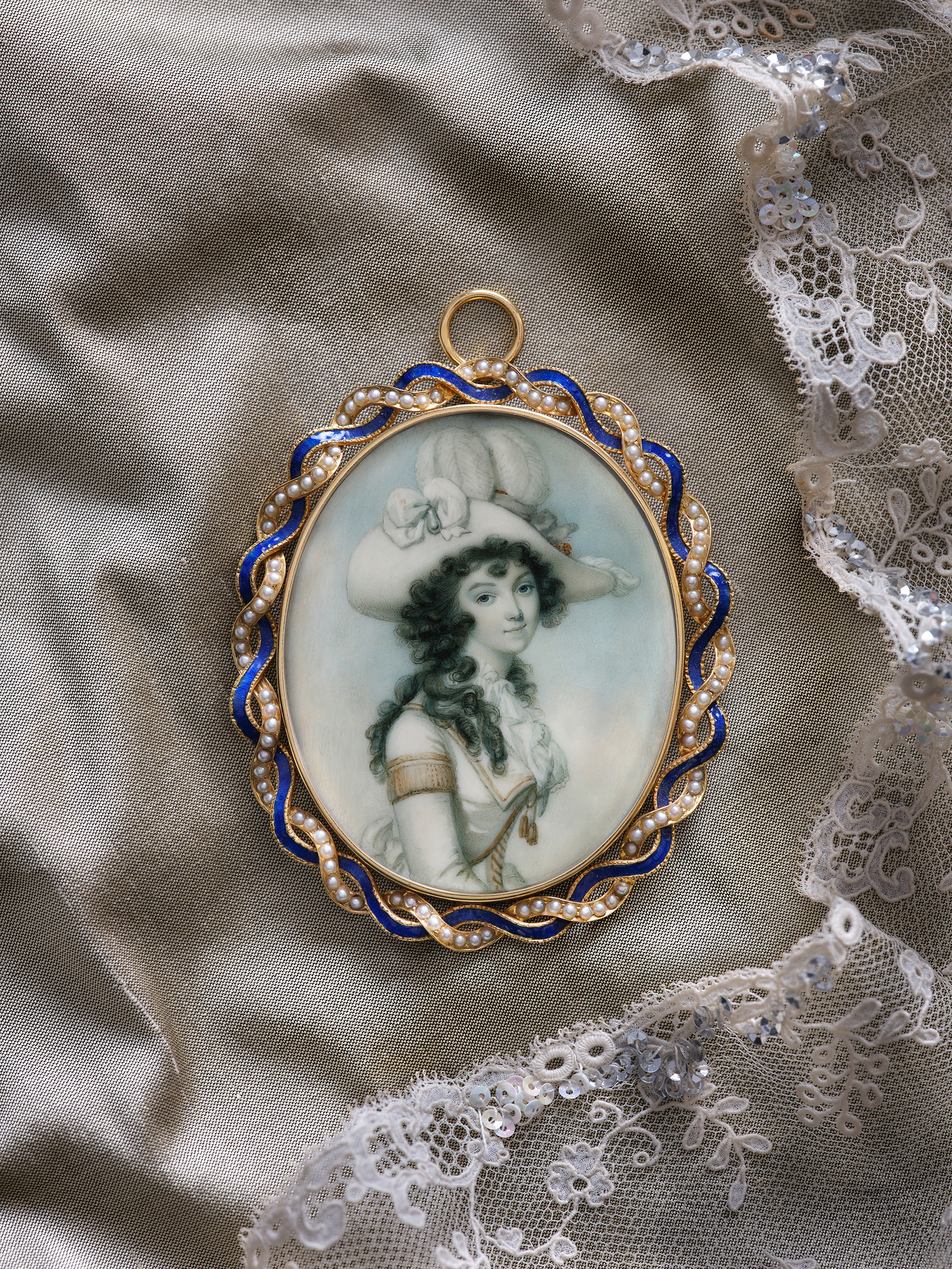 Portrait miniature of Miss Turner of Uxbridge, wearing riding costume trimmed with gold braid and a large plumed hat with bows