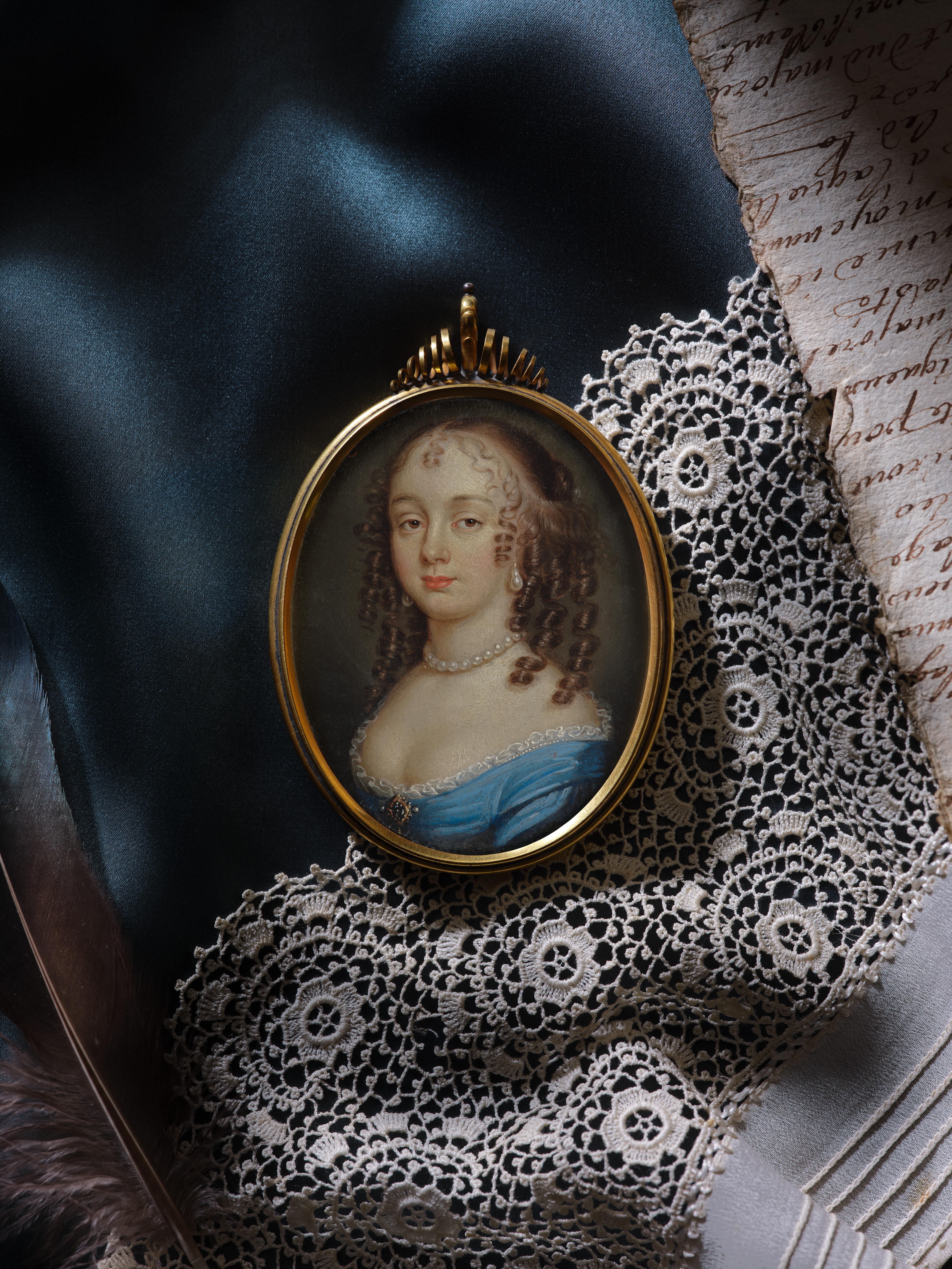 Portrait of a Lady, wearing blue dress with white lace trim and gold, pearl and diamond brooch at her corsage, pearls at her neck and pearl earrings