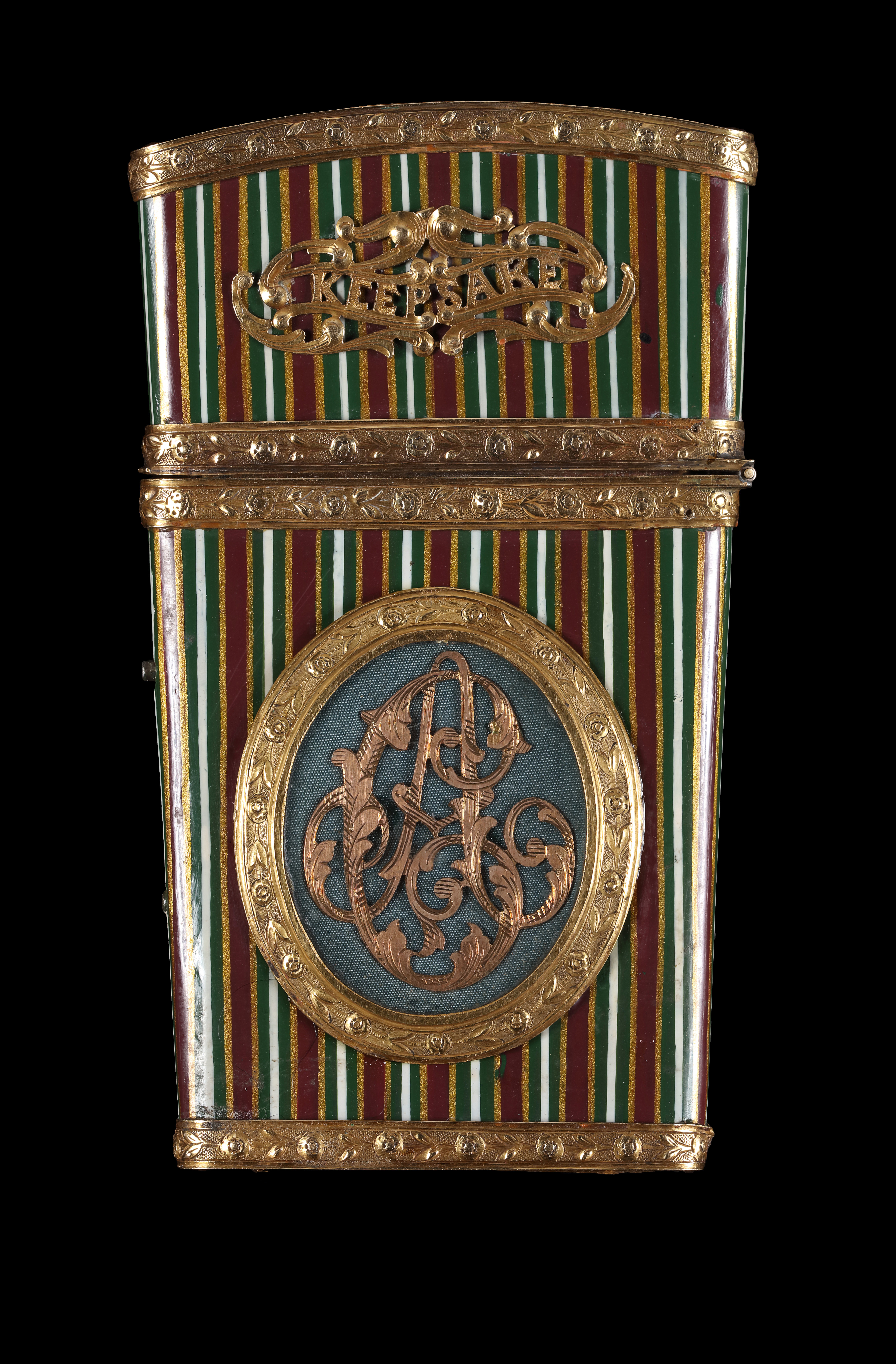 Portrait miniature of a Lady, wearing white gown, her hair powdered, set into a vari-coloured gold and painted papier-mache carnet-de-bal