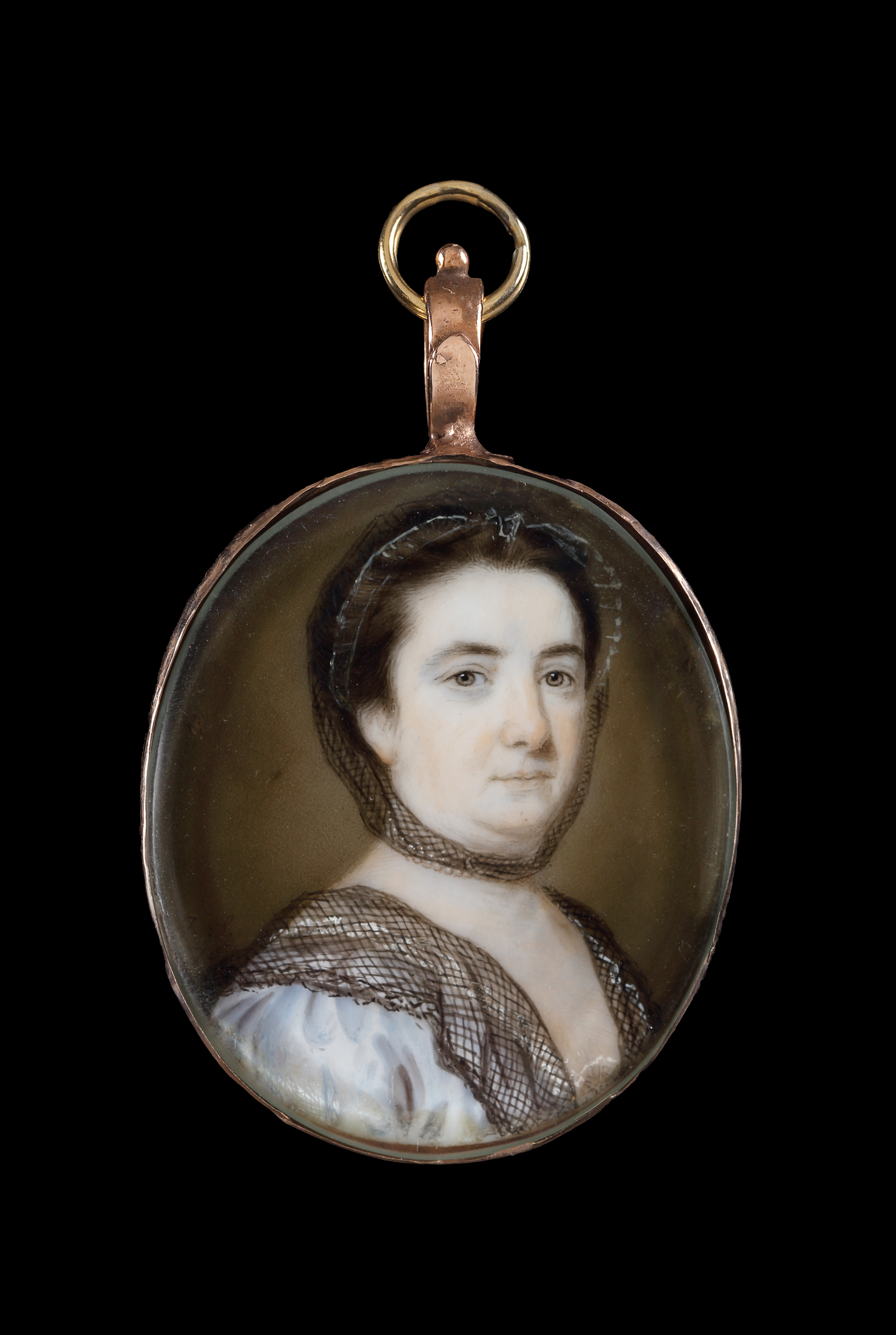 Portrait miniature of a Lady, wearing pale blue dress, white lace cap under black lace and black lace shawl