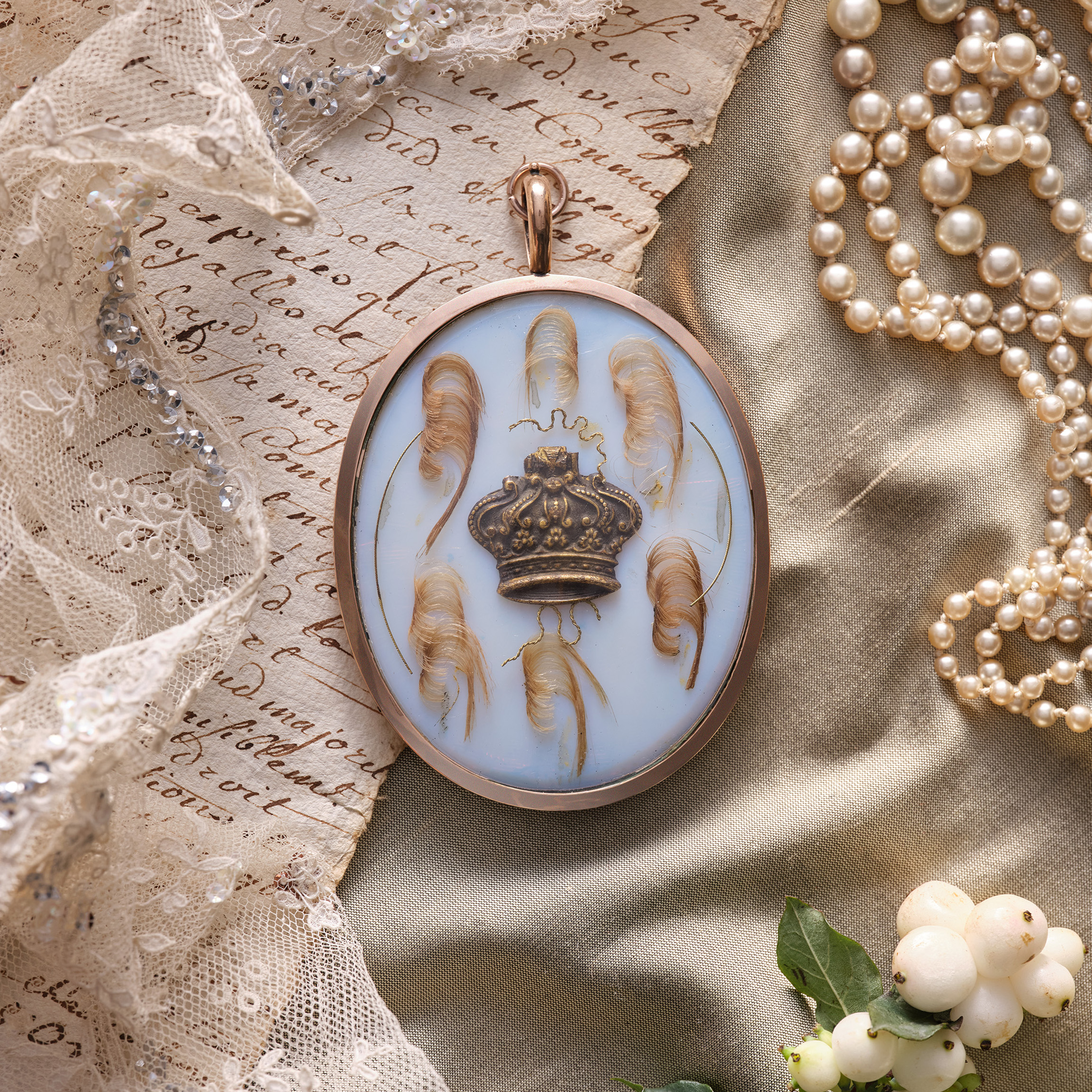 Portrait miniature of Marie-Antoinette, Queen of France (1755-1793), profile to the left, wearing white gown, pearl necklace and earrings and pearl and ostrich feather bandeau over the powdered hair