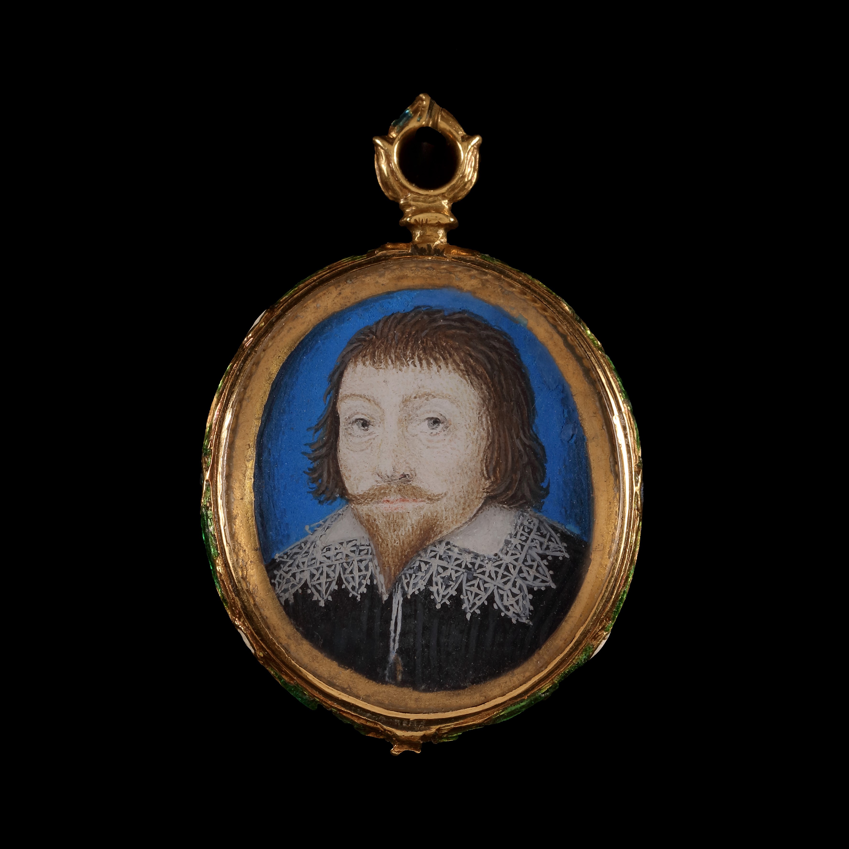 Portrait miniature of a Gentleman, wearing black doublet and white collar trimmed with lace, blue background and gold border