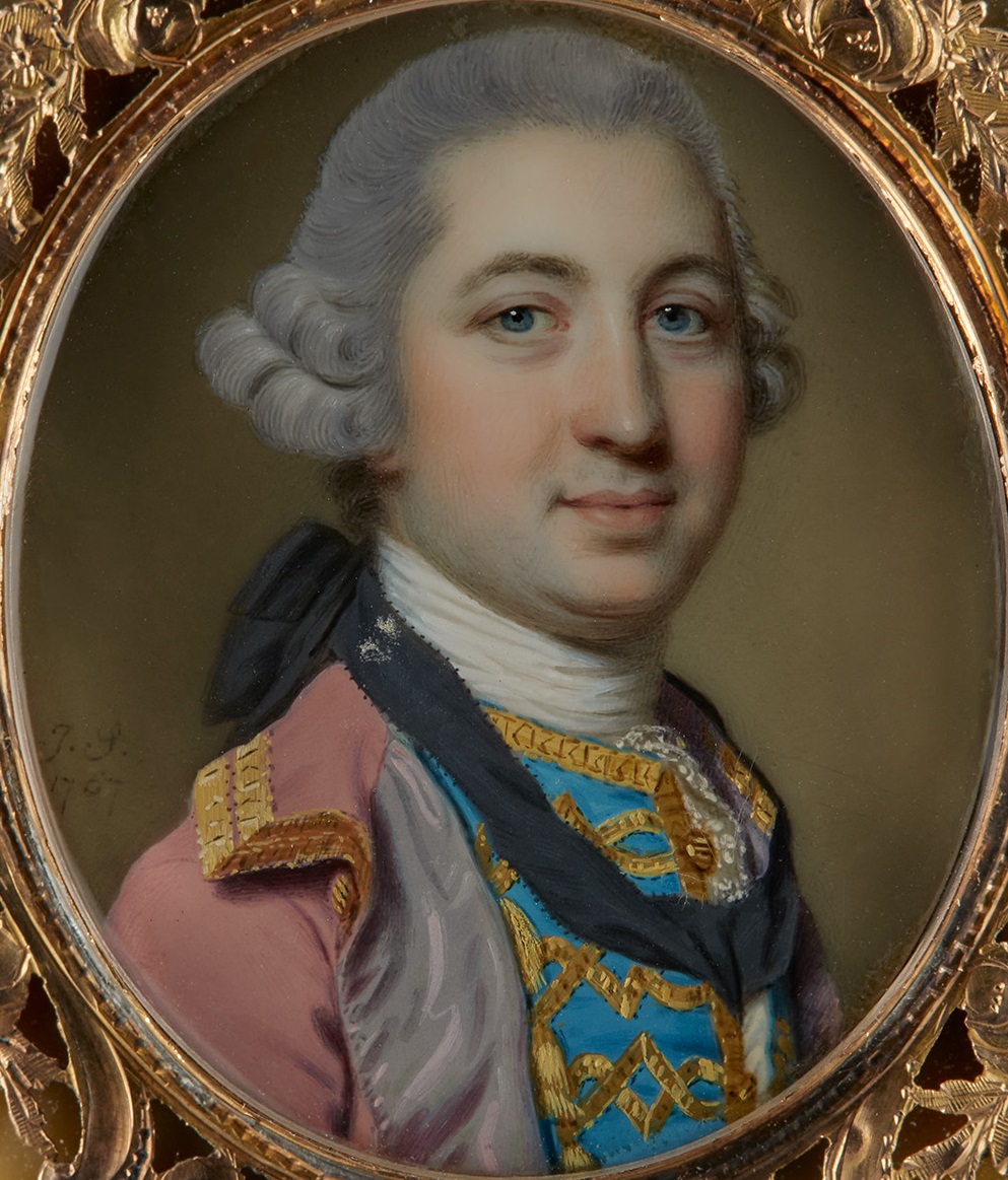 Portrait miniature of Sir Rowland Winn, 5th Bt (1739-1785), Bt., wearing a pink silk frock coat with lilac lining trimmed with gold, a blue waistcoat embroidered with gold and a black silk solitaire ribbon tied at the back of his powdered wig