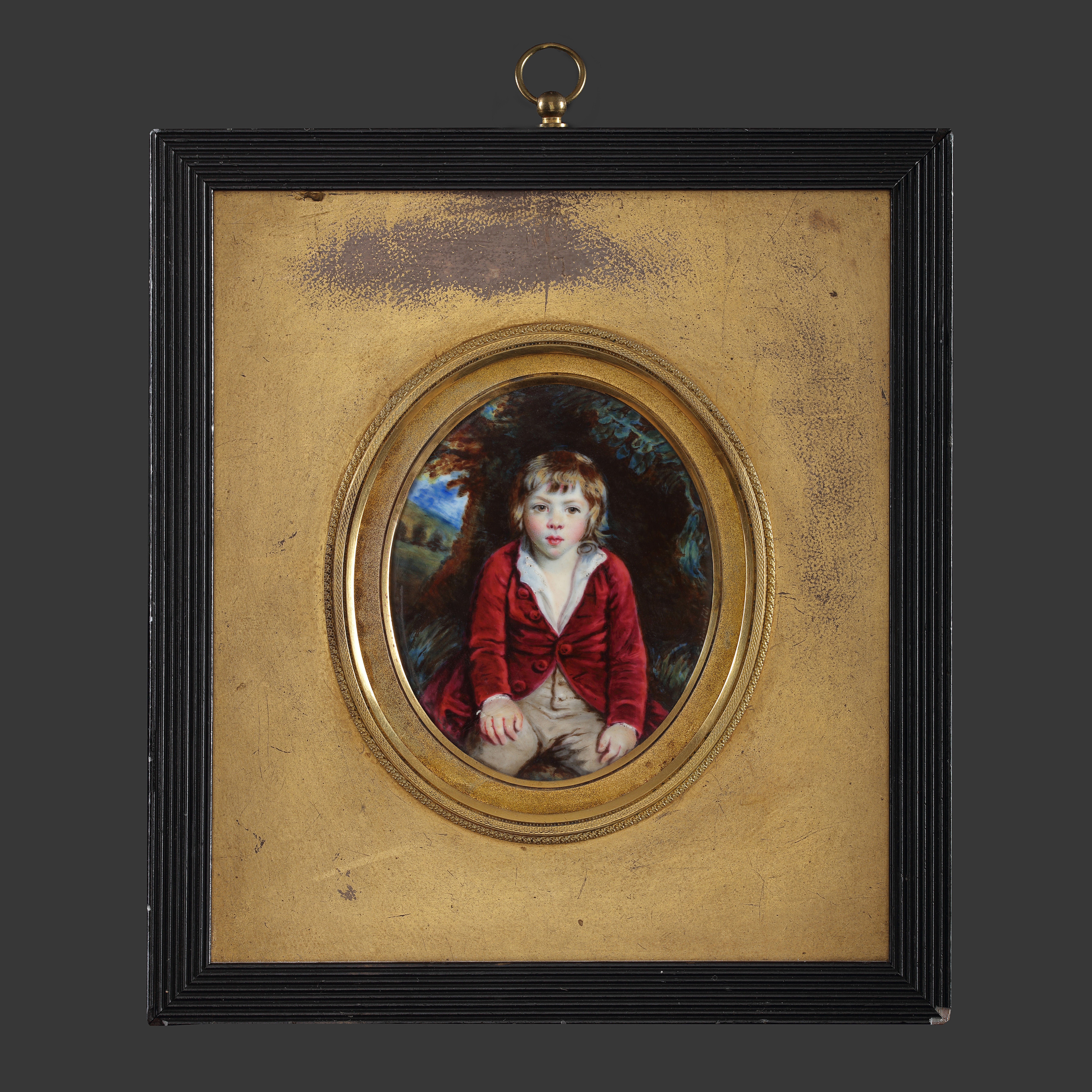 Portrait enamel of Master Henry Edward Bunbury (1778-1860), wearing red velvet coat with white shirt and buff trousers, against a landscape background