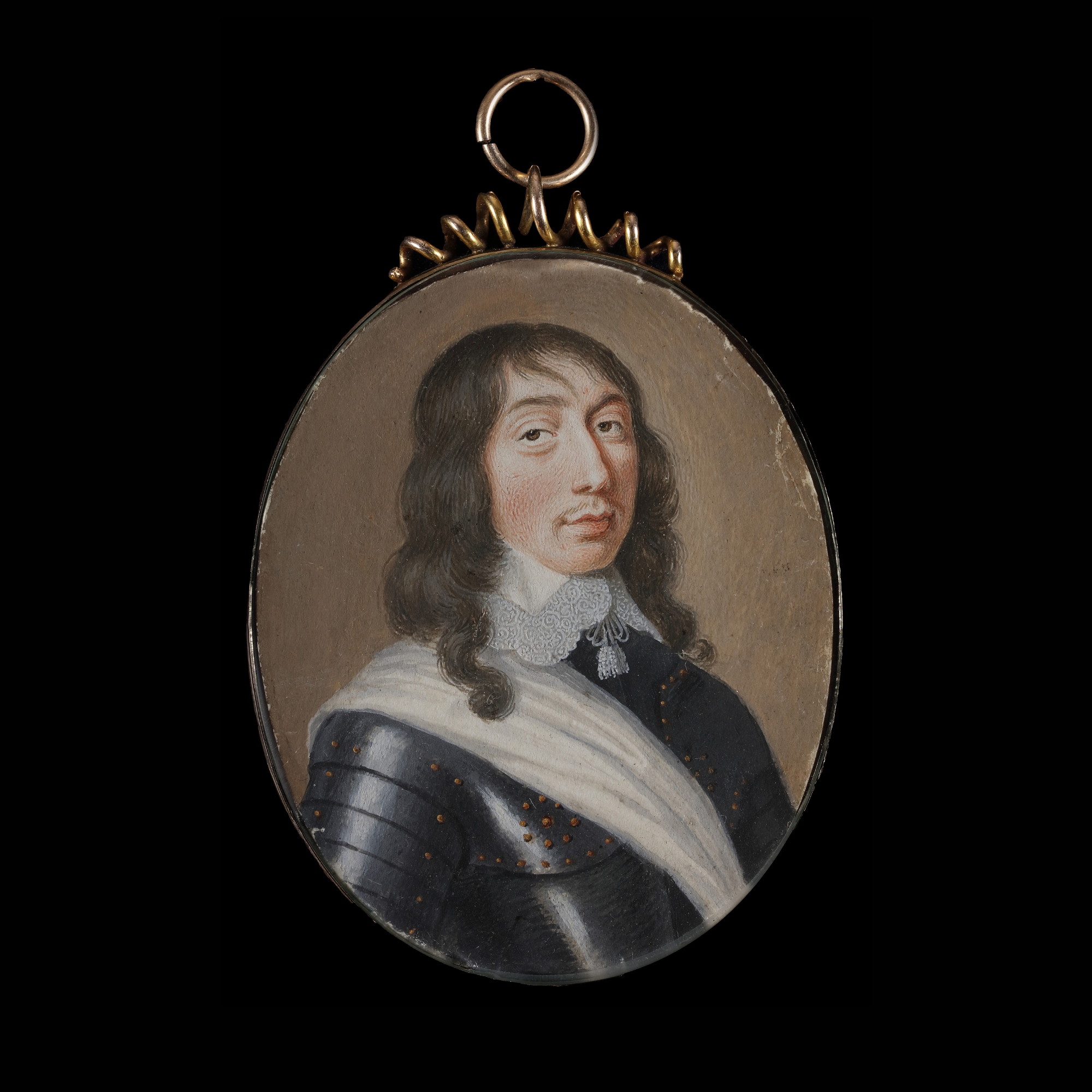 Portrait miniature of an Officer, wearing gilt-studded armour, a sash and lace-edged lawn collar with tassels