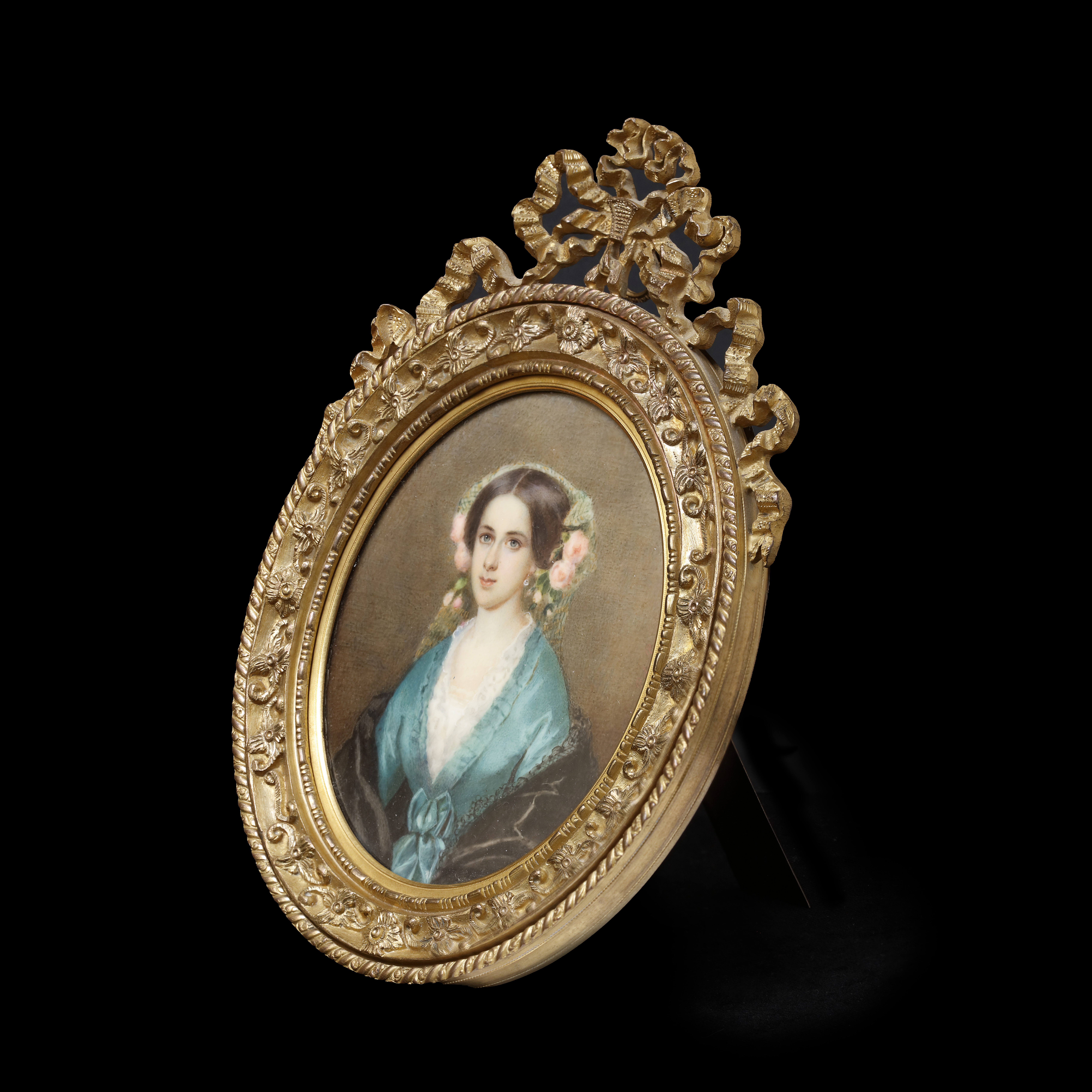 Portrait miniature of a Lady, called J. Berville Fremer, wearing green silk dress with ribbons, white chemise, black silk mantle, and green headdress with pink roses