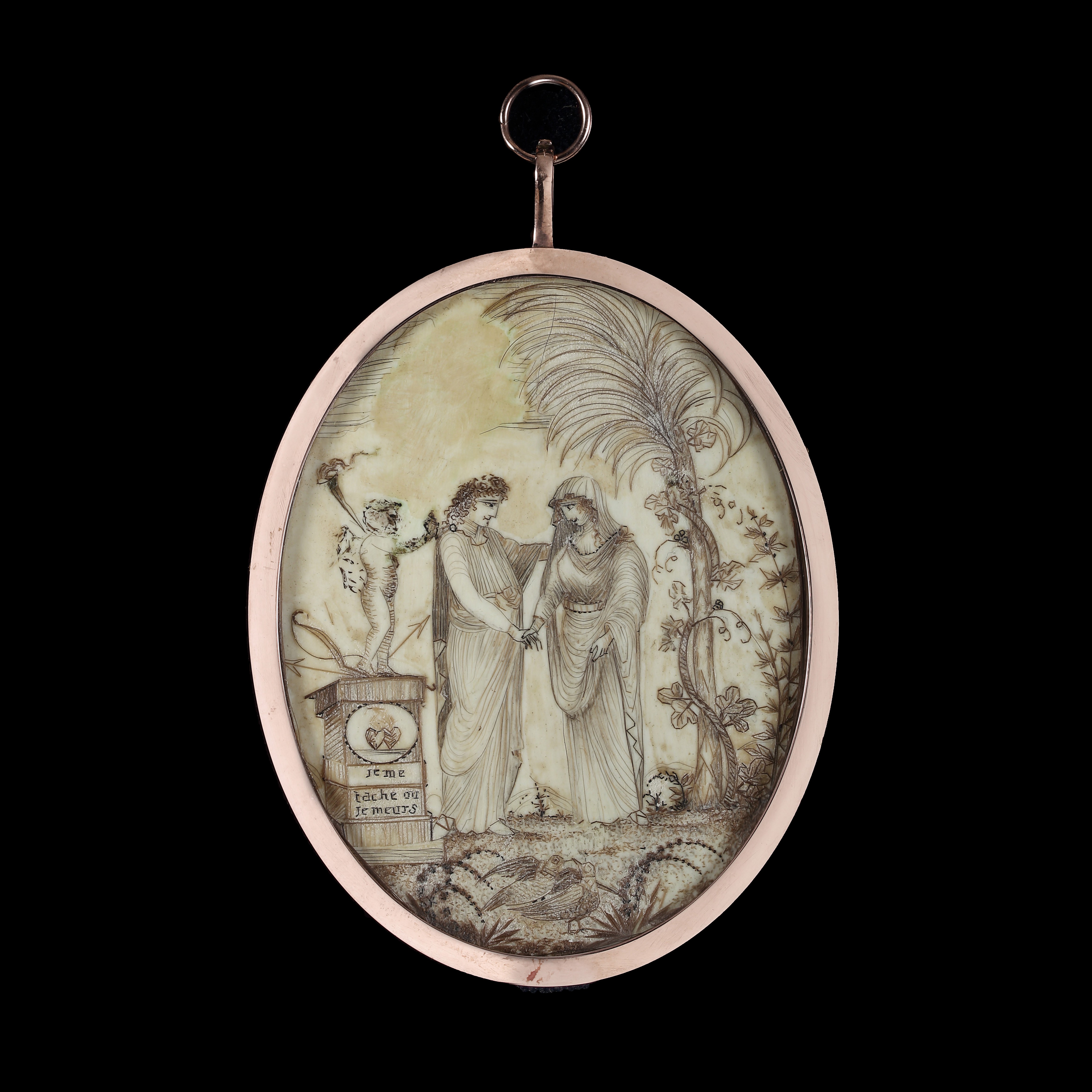 A double-sided hairwork miniature, the front decorated with a couple in a garden, with ‘Je me tache ou je meurs’ inscribed on a pedestal, also decorated with two flaming hearts, the pedestal surmounted by a cupid, the other with a woman fleeing through a garden, with ‘Amicizia’ inscribed on a pedestal