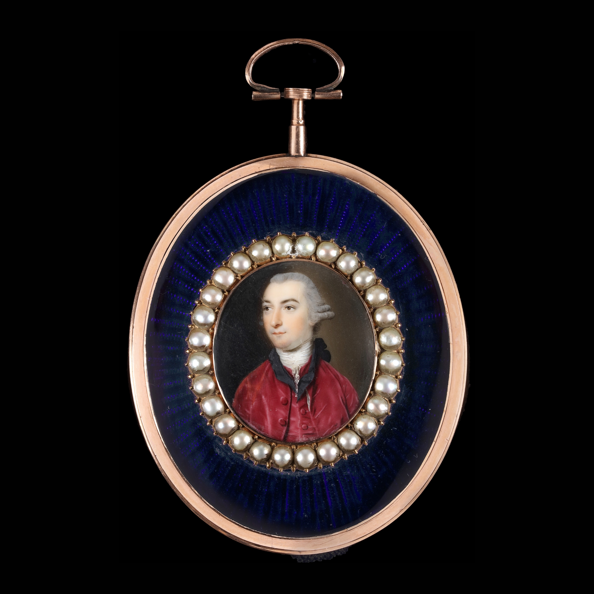 A portrait miniature of a Gentleman with powdered hair en queue and tied with a black ribbon, wearing a white stock and crimson velvet jacket and waistcoat, 1766