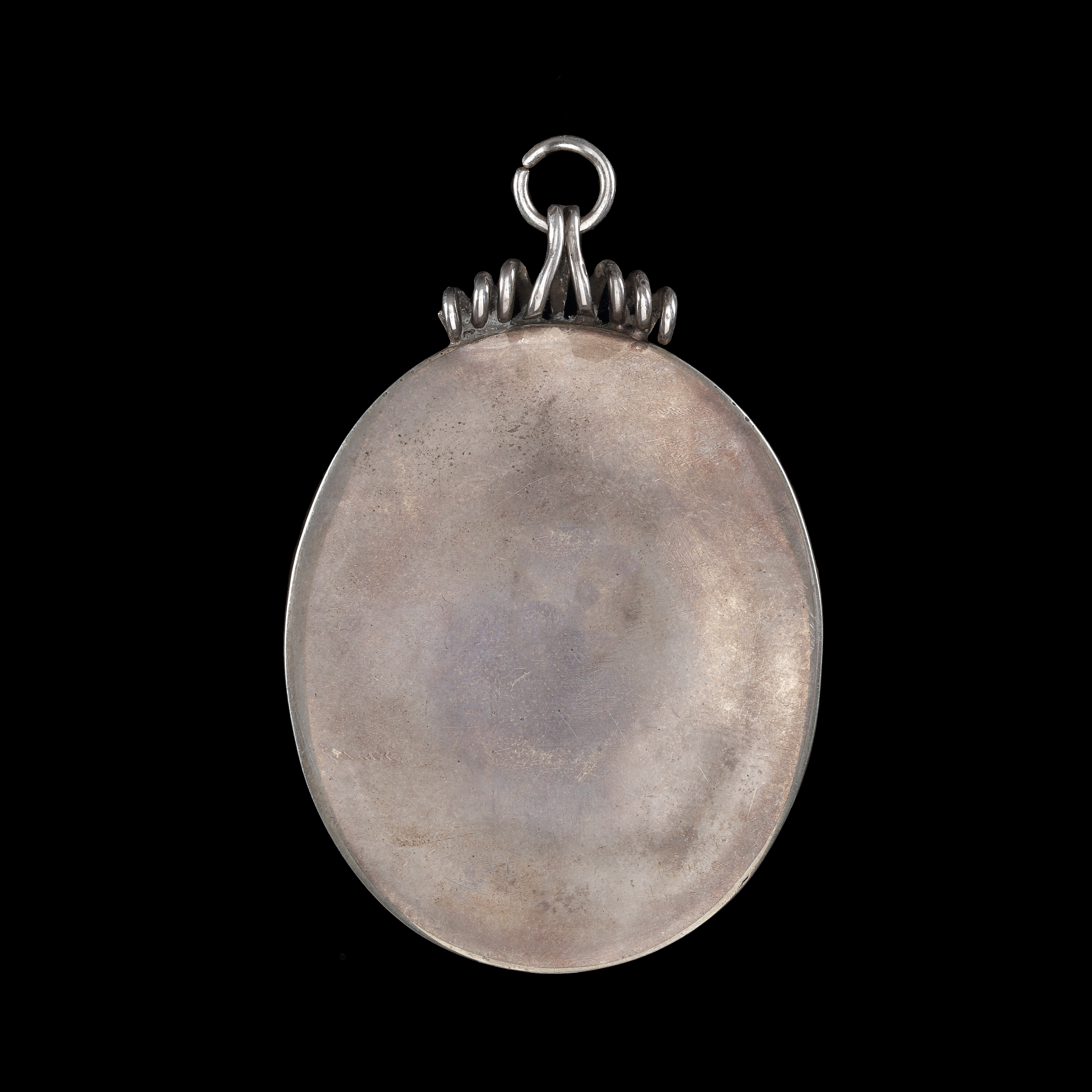 Portrait miniature of a Lady, wearing black dress with white lace border, white lace collar and black rosette, pearl earrings and pearls in her curled hair