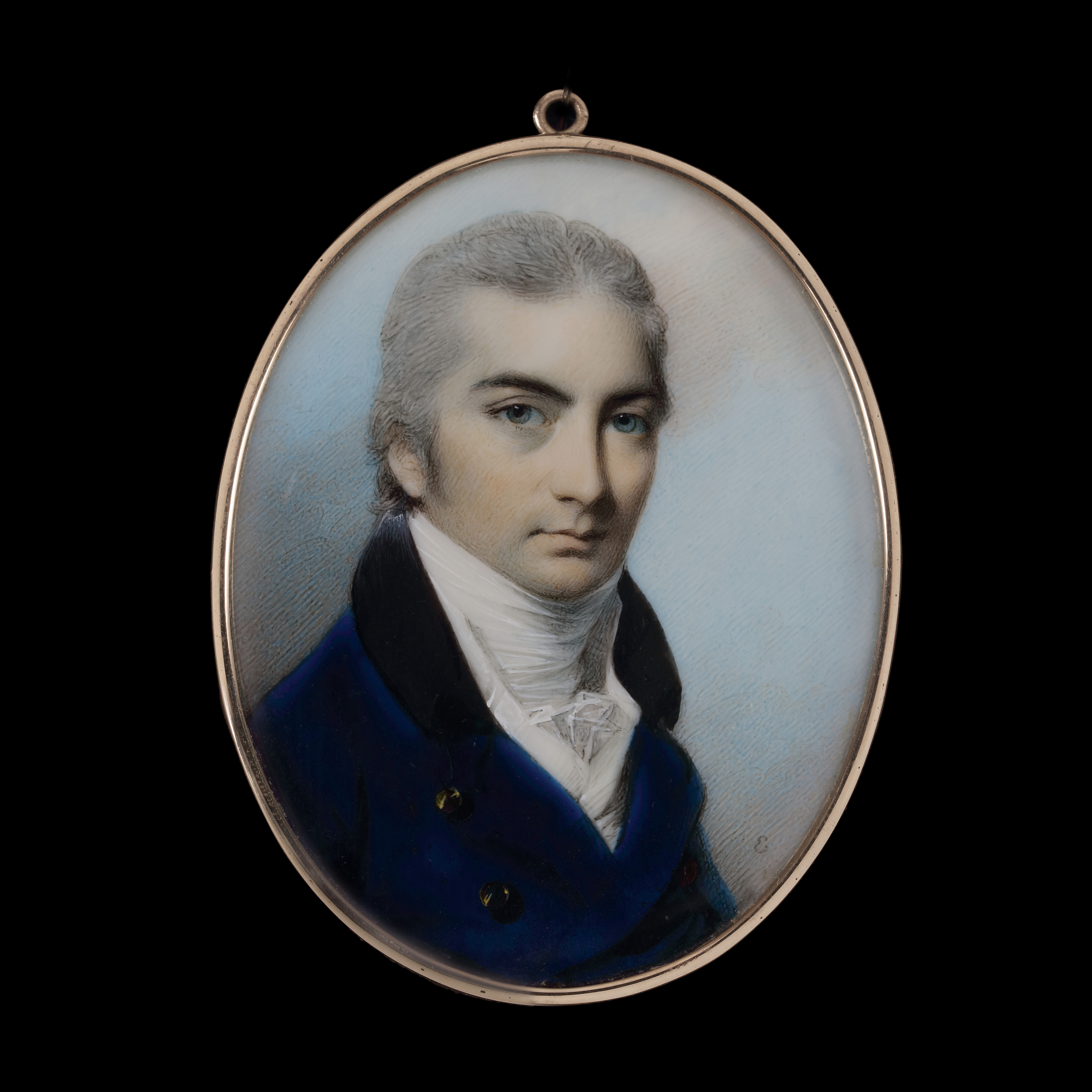 A portrait miniature of a Gentleman, wearing dark blue coat with black collar, white waistcoat and stock
