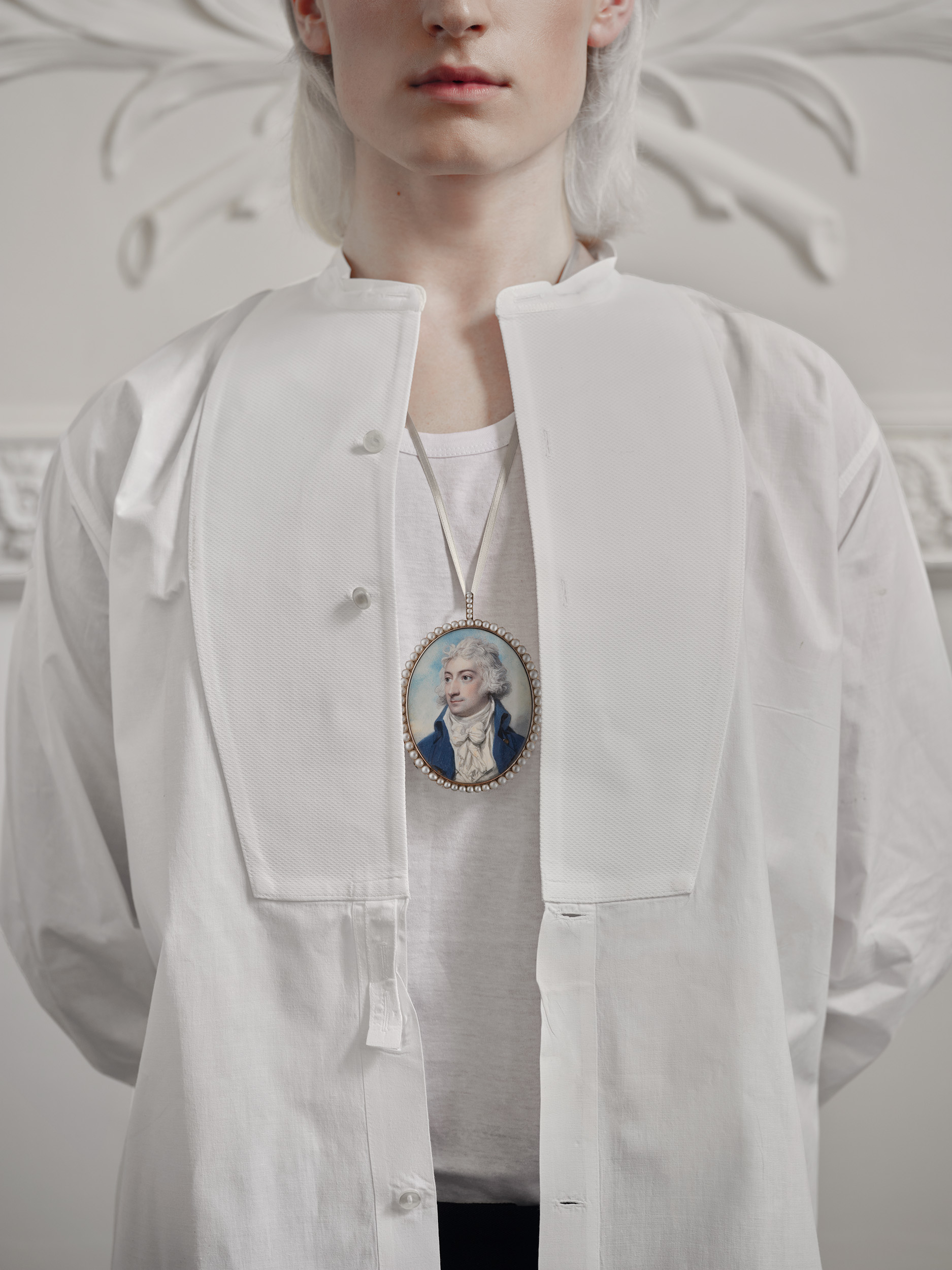 Portrait miniature of a Gentleman, with the initials ‘CC’, wearing blue coat with brass buttons, white waistcoat and tied stock, his hair powdered