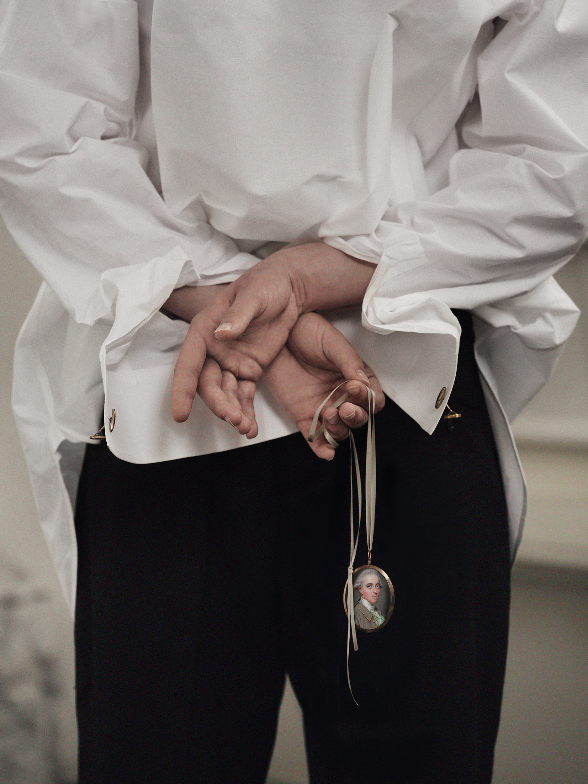 Portrait Miniature of Sir George Paunceforte-Bromley, 2nd Bt. (1753-1808), wearing a brown coat with gold trim and buttons, a light green waistcoat, and white stock and lace cravat, his hair powdered pink and worn en queue 