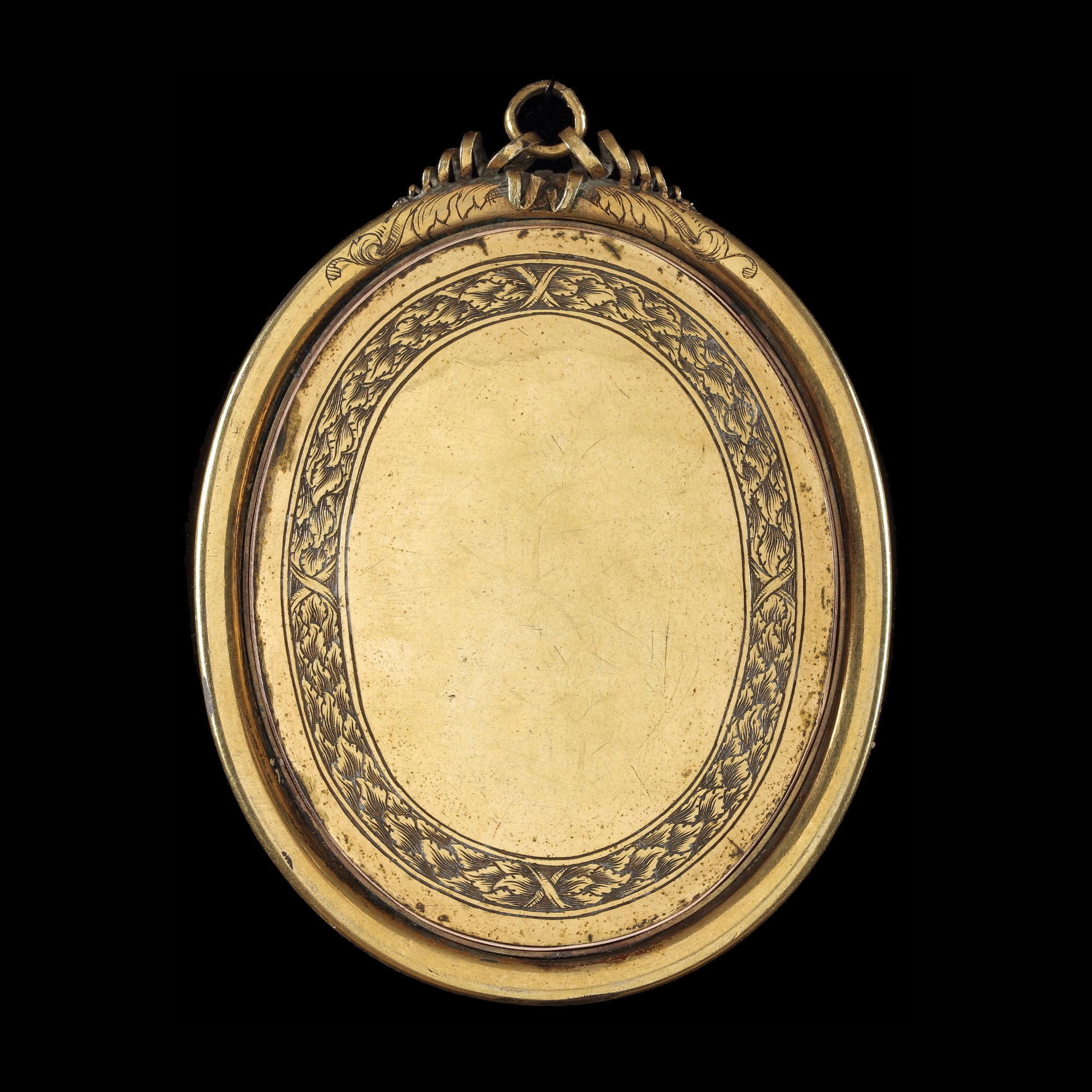 A portrait miniature of a Young Gentleman, wearing pale blue doublet over a white shirt and blue cape fastened with a jewelled pin at his shoulder and white lace jabot