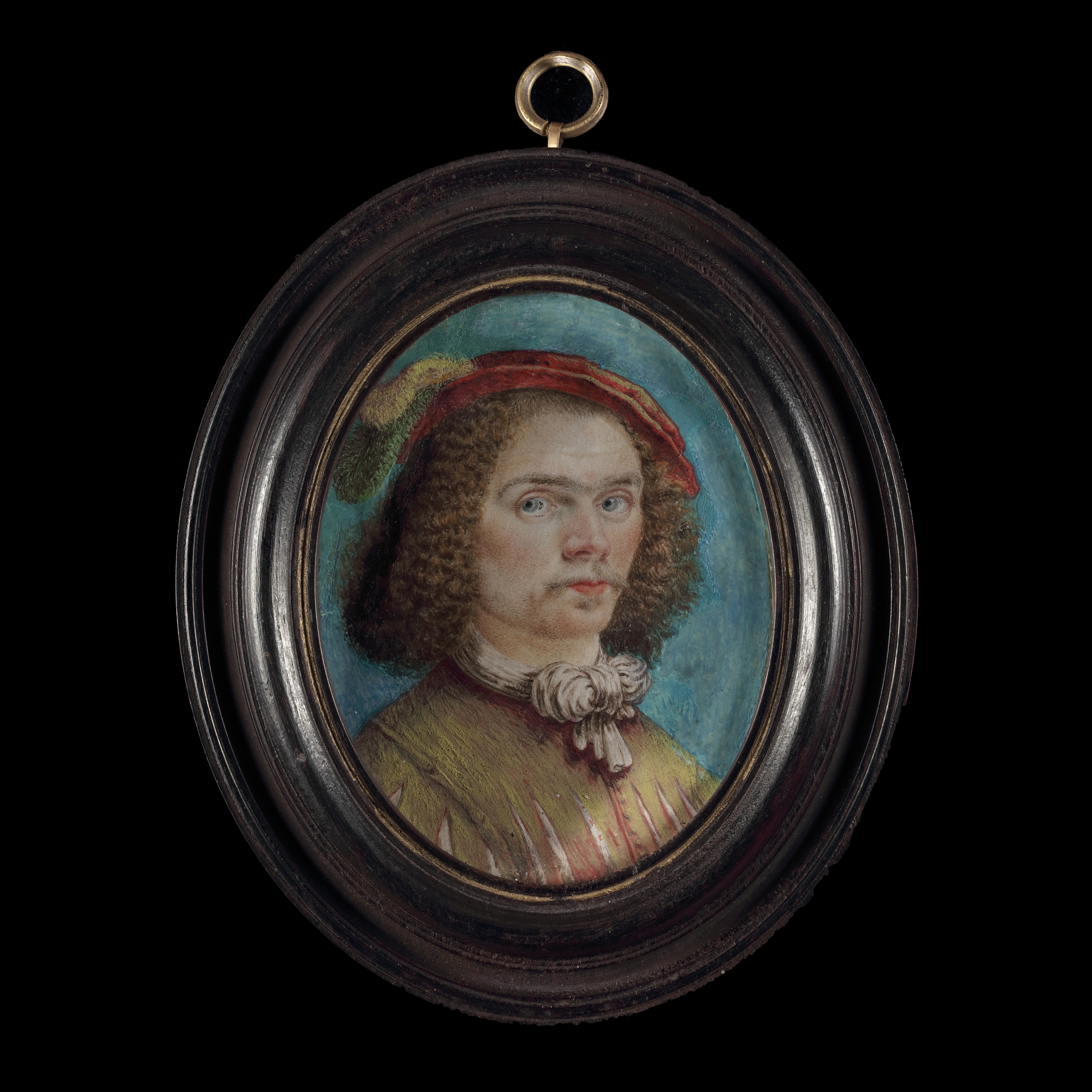 Portrait miniature of a Gentleman, wearing brown slashed doublet with tied neckscarf, a felt cap with green and white feathers on his curled hair
