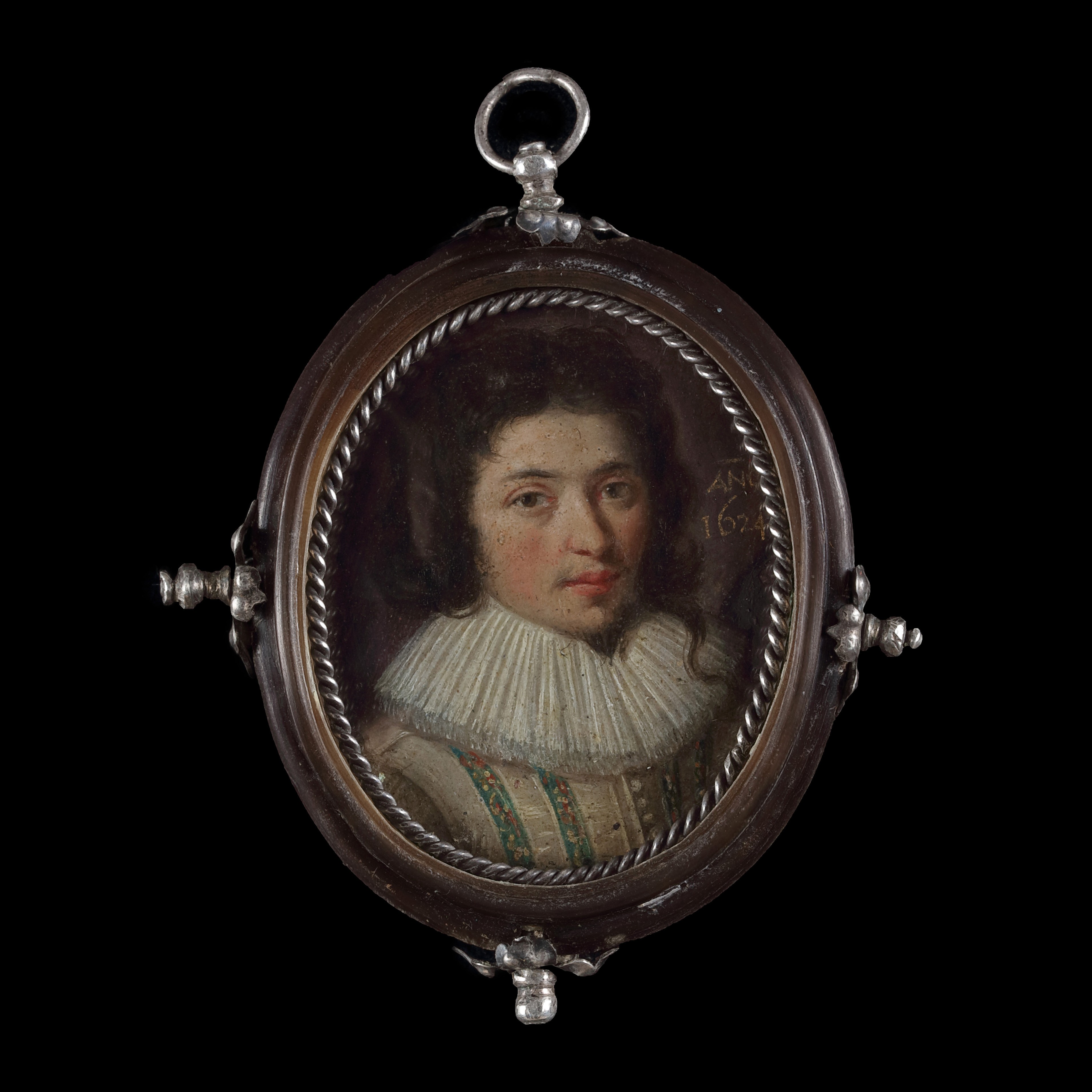 Portrait miniature of a Gentleman with brown hair in a lovelock on his left, wearing a falling white ruff and a cream doublet with blue embroidered panels