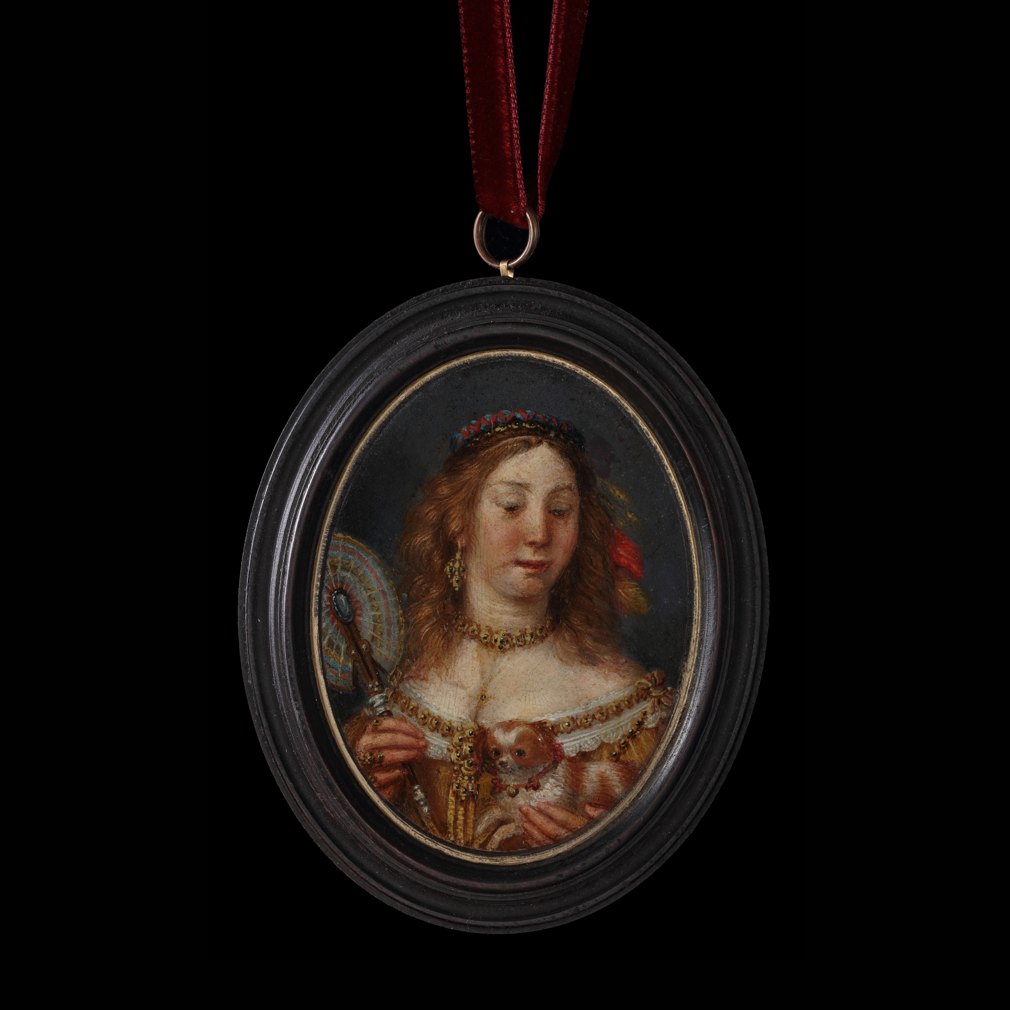 A Lady in the guise of Esther, wearing low-cut apricot-coloured dress with gold chain, multicoloured fan and ribbons and feathers in her loose hair, a dog wearing a bell collar in her left hand