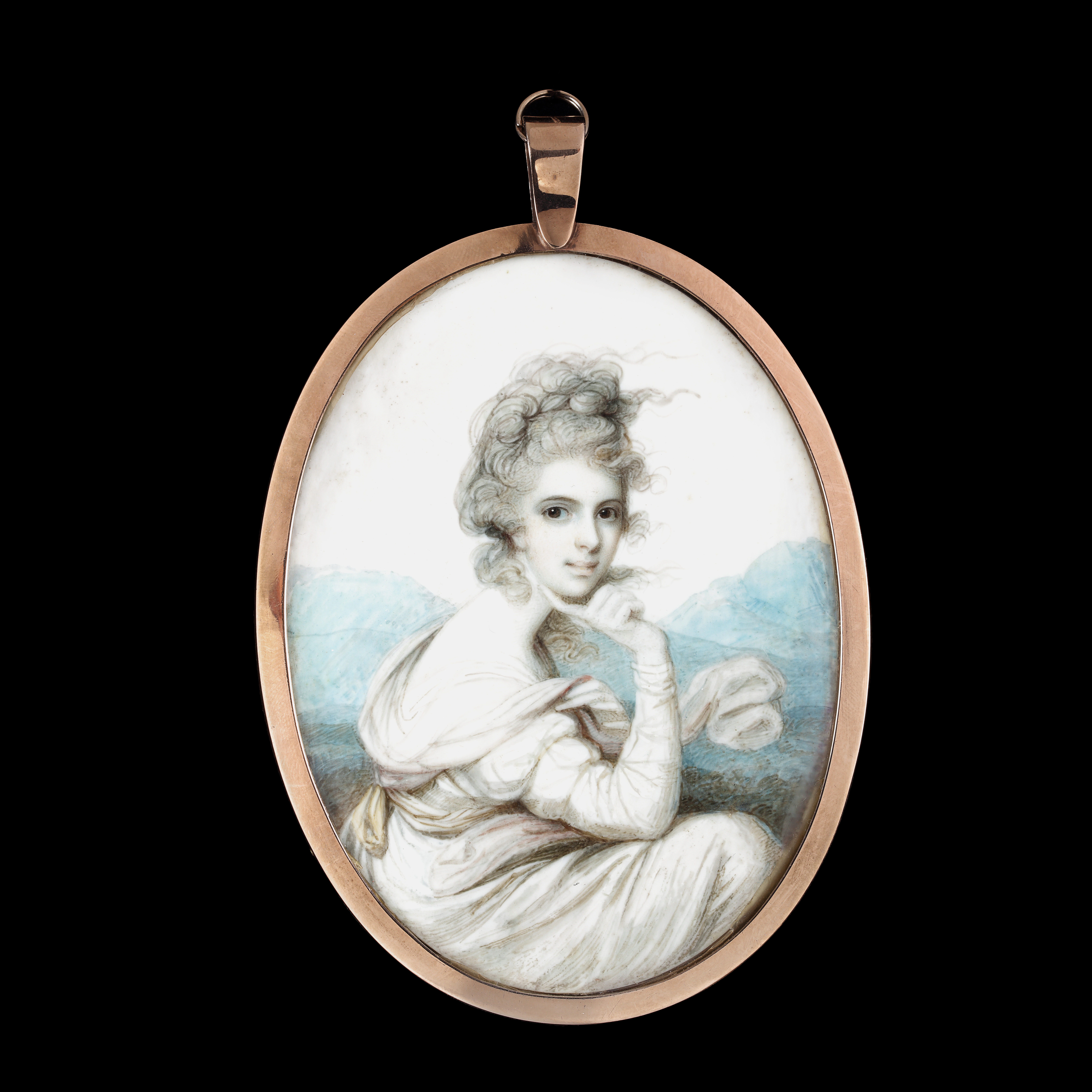 Portrait miniature of a Lady before a mountainous landscape wearing a white dress with a pale yellow sash around her waist, a shawl about her shoulders, her hair curled and worn up