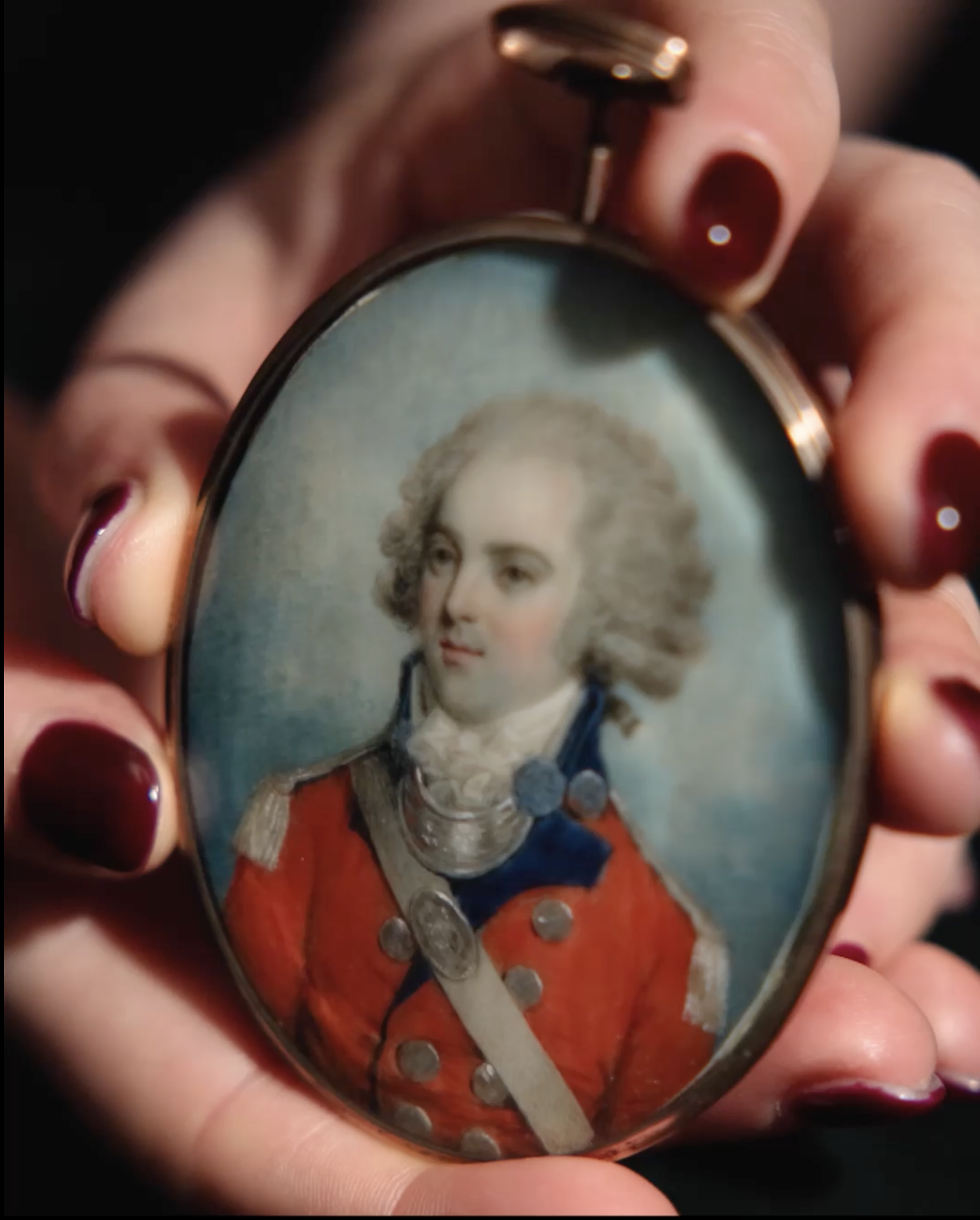 Portrait miniature of a Gentleman, traditionally called Peter de Bath, wearing officer’s  uniform, scarlet coat with blue facings, silver buttons, epaulettes, gorget, and shoulder- belt plate
