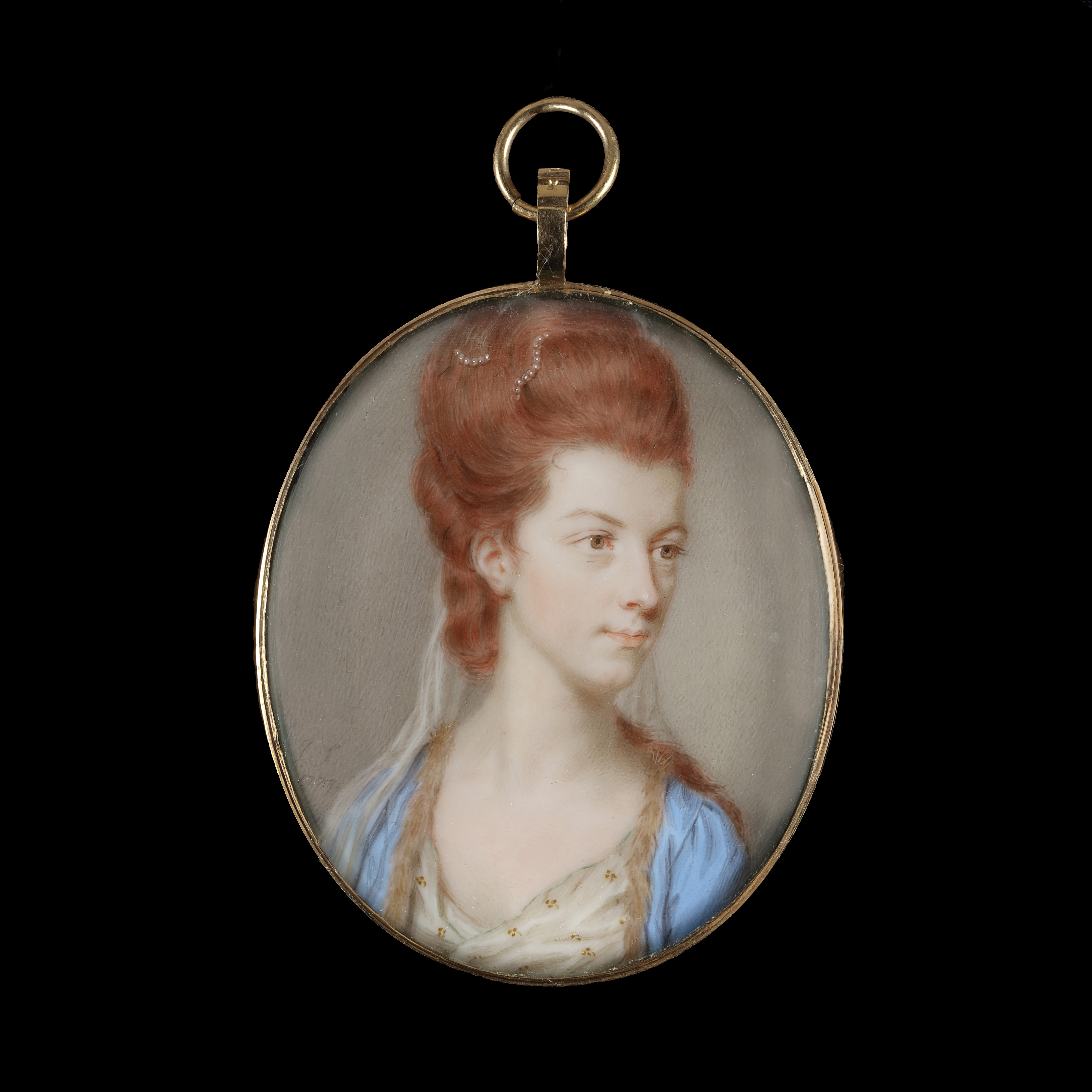 Portrait miniature of a Lady, Traditionally identified as Viscountess Townshend, later Anne, 1st Marchioness Townshend (b.c.1752-1819), wearing a blue fur-trimmed coat, white embroidered dress, her hair powdered auburn and worn up; 1777