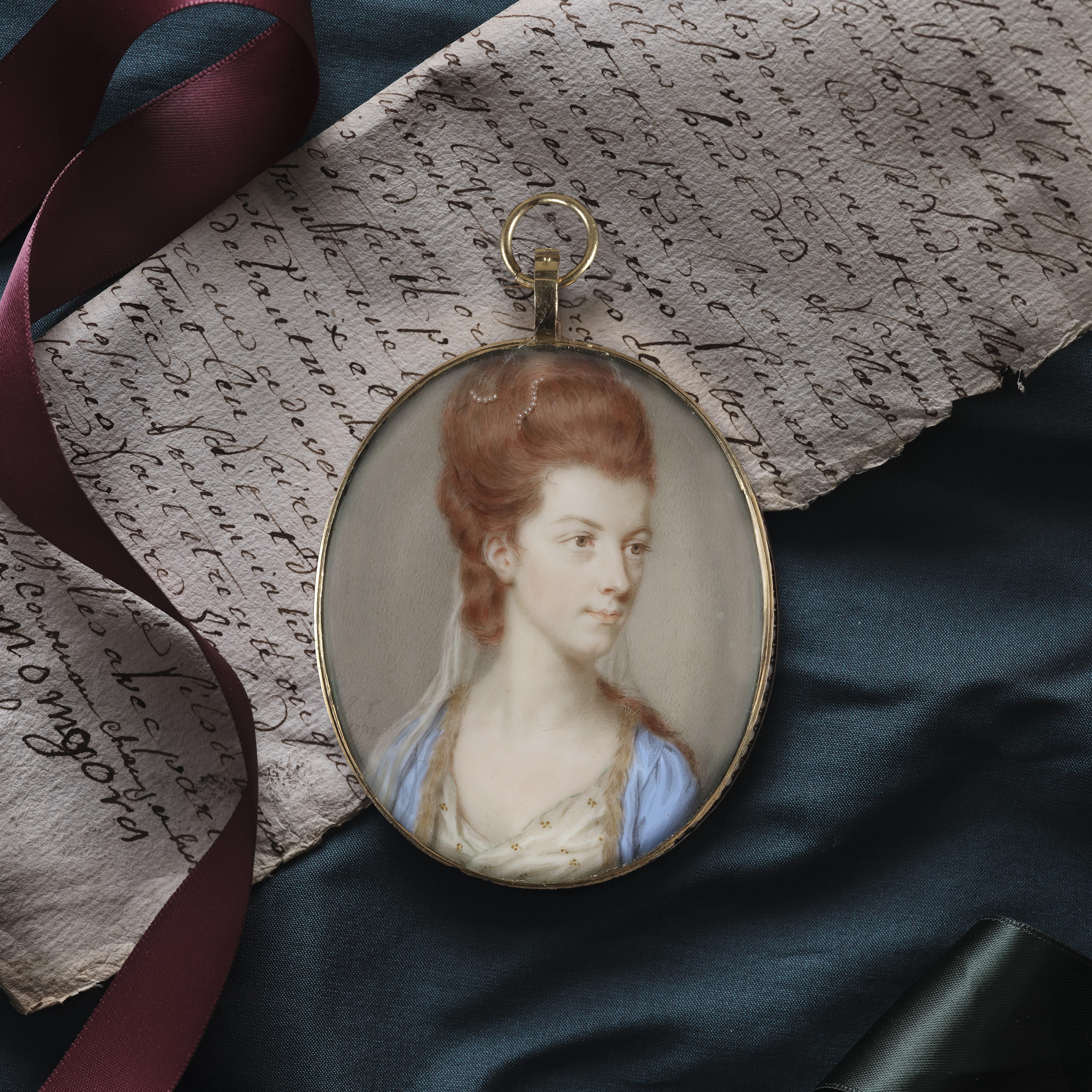 Portrait miniature of a Lady, Traditionally identified as Viscountess Townshend, later Anne, 1st Marchioness Townshend (b.c.1752-1819), wearing a blue fur-trimmed coat, white embroidered dress, her hair powdered auburn and worn up; 1777