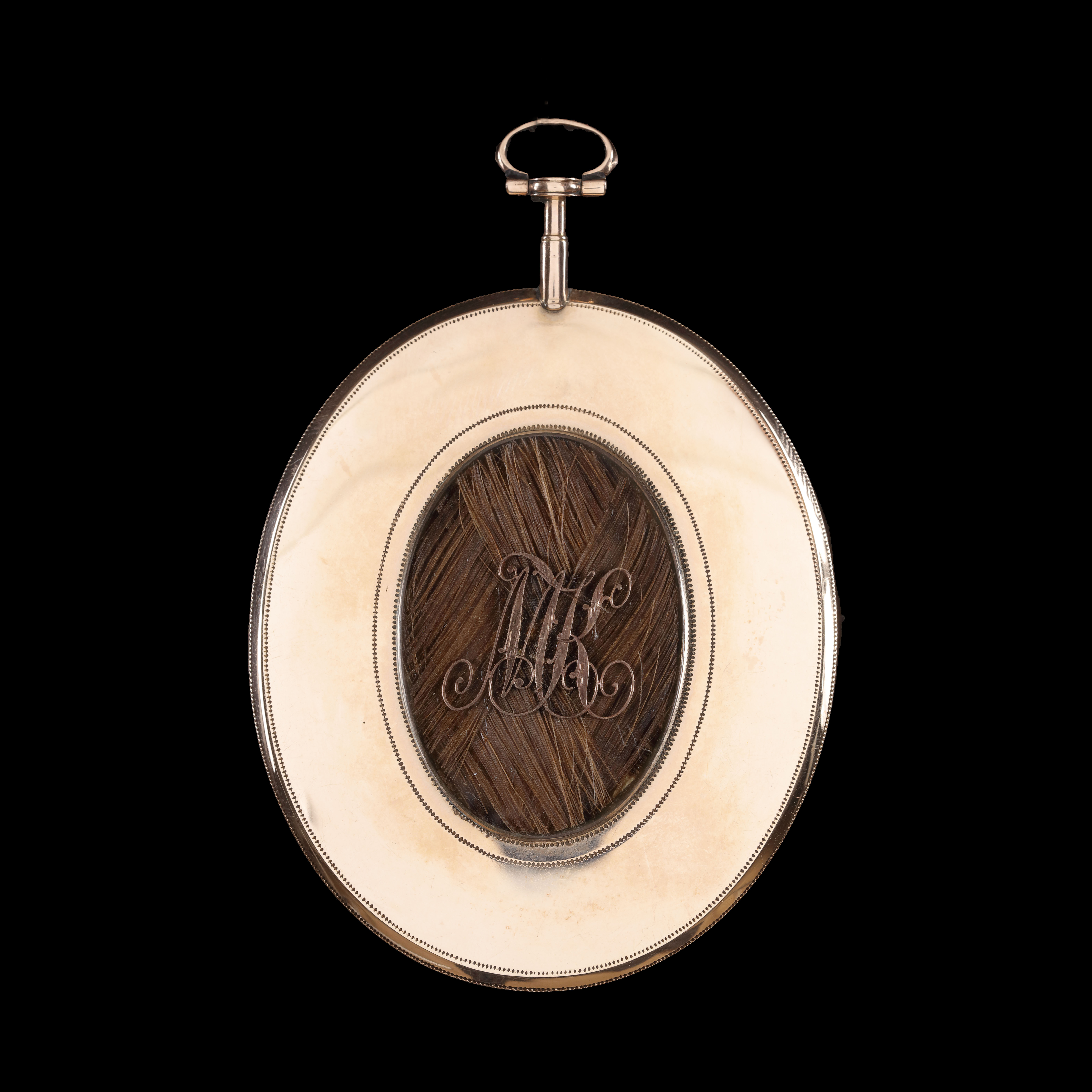 Portrait miniature of a Young Lady wearing a chemise dress with a pink bow at her décolletage and a pink sash at her waist, her hair powdered and topped with a white ribbon or cap; circa 1785