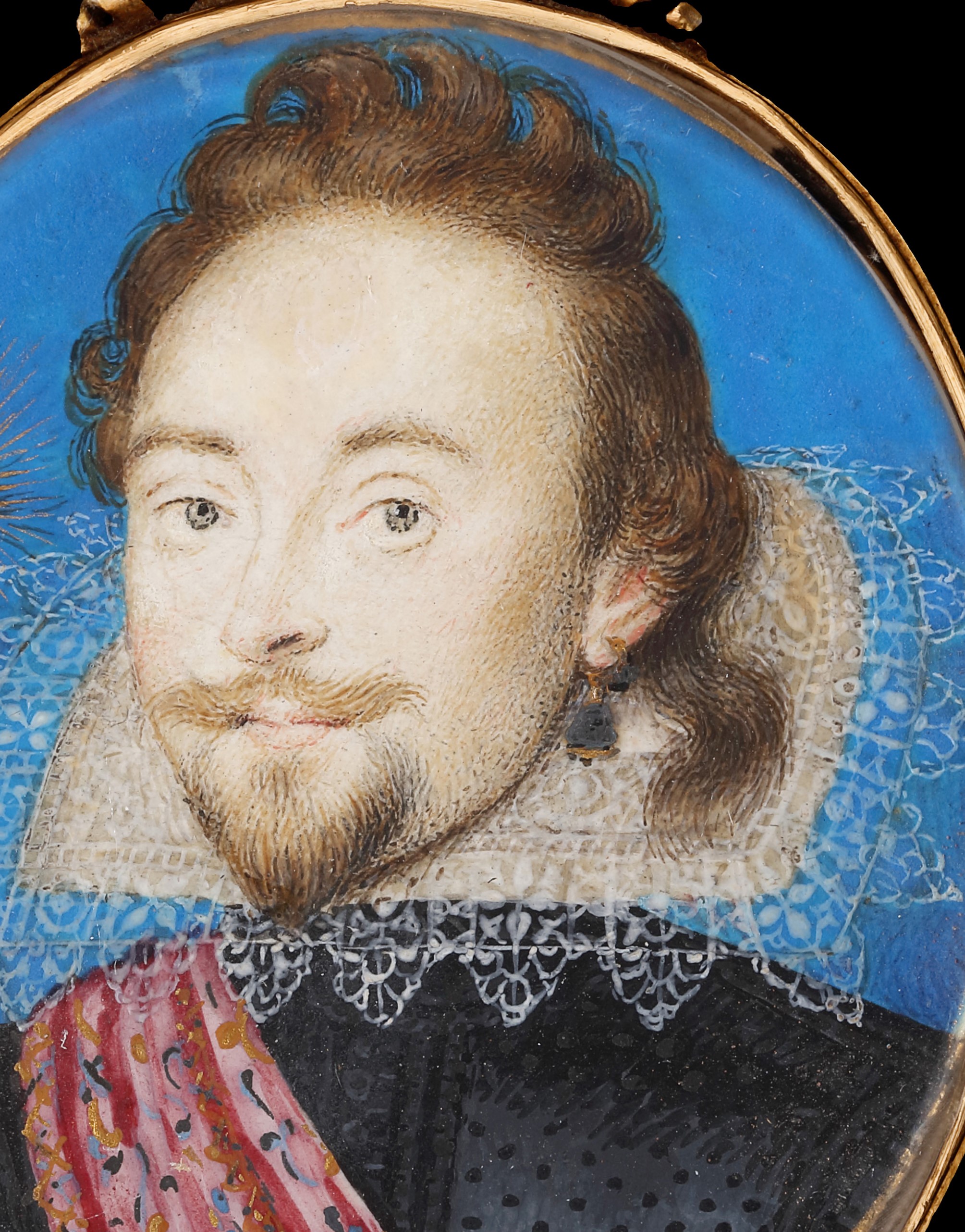 Portrait miniature of a Nobleman wearing a black doublet with an embroidered pink sash, a rebato collar with scalloped lace edging, and a large gem stone earring; his hair in a ‘lovelock’ on his left; a gold sunburst over his right shoulder