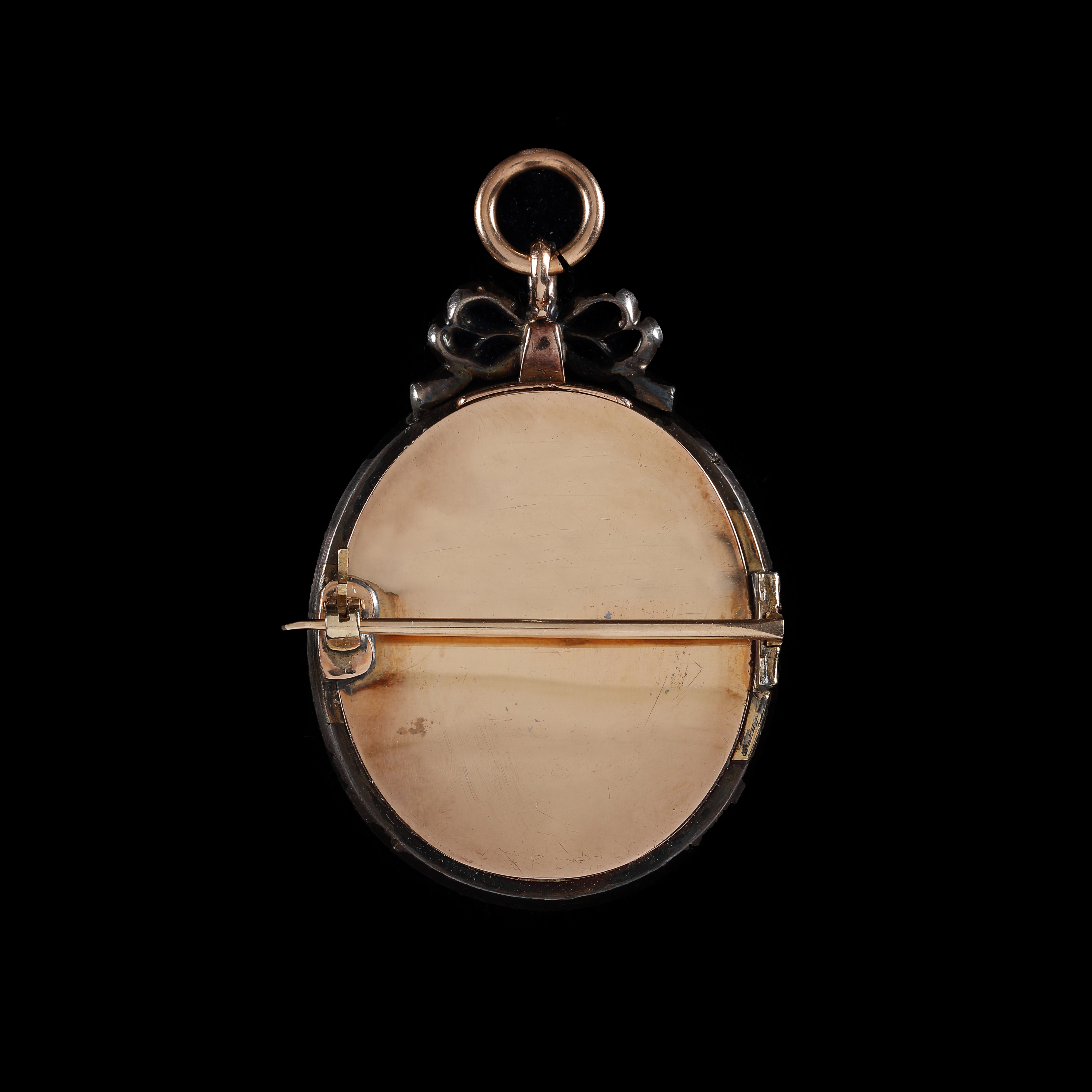 Portrait miniature of a Gentleman, traditionally identified as Consul Murray, wearing a green coat, embroidered floral waistcoat and a white stock, with a pink powdered wig