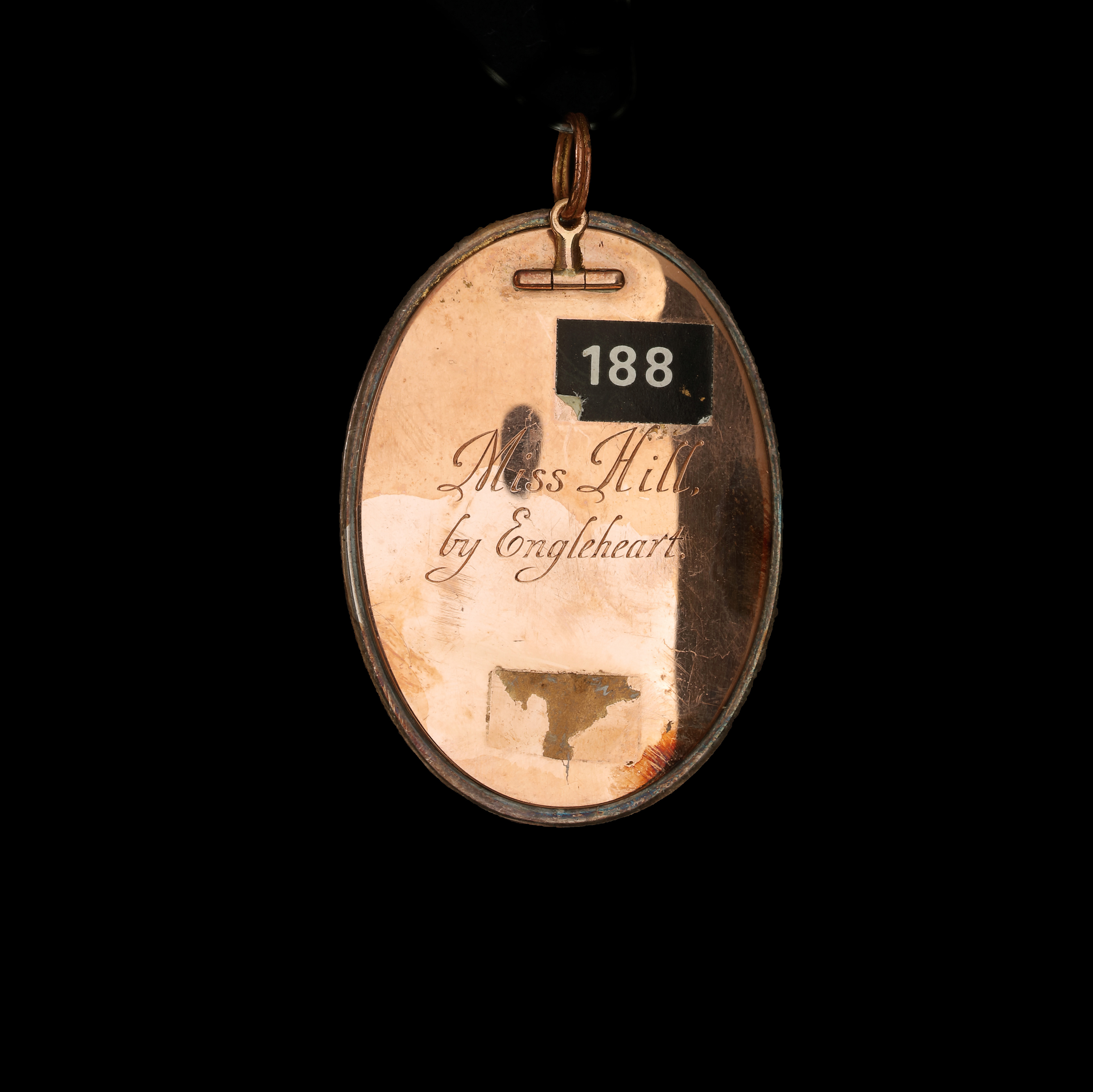 Portrait miniature of a ‘Miss Hill’, facing right, in décolleté yellow dress with frilled under slip and white bandeau in her powdered hair