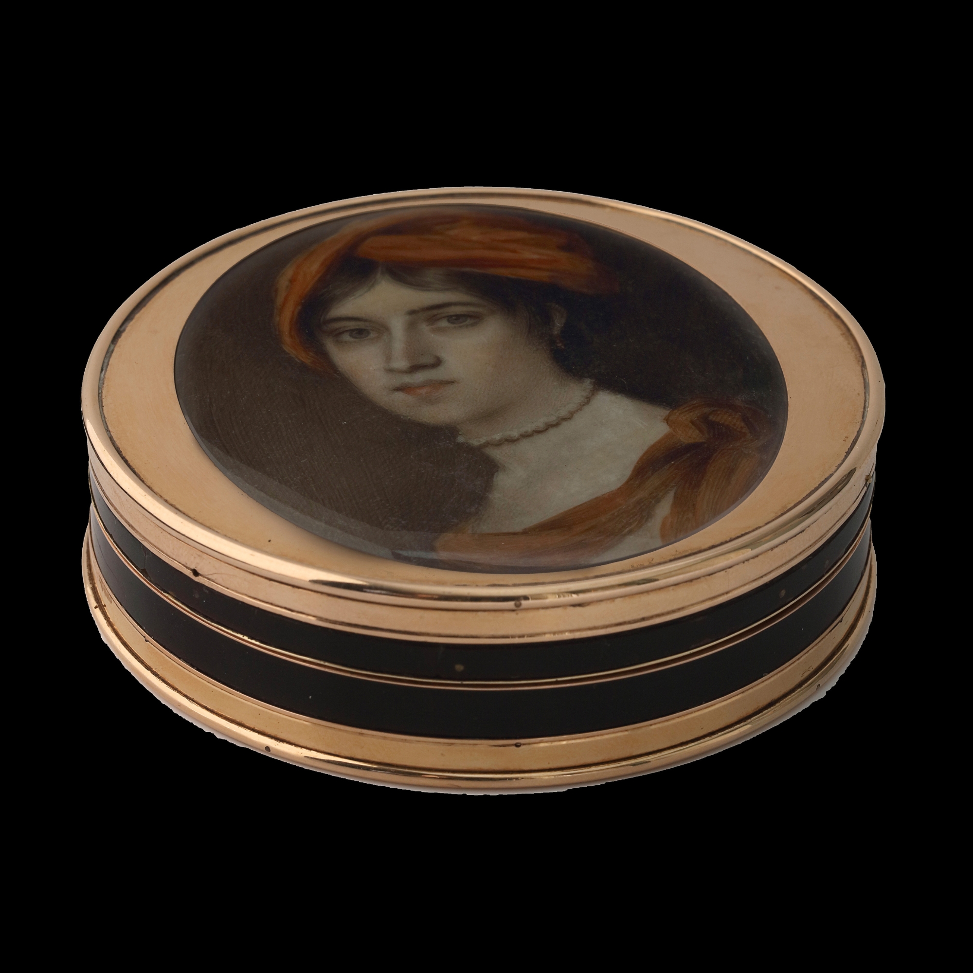 Portrait miniature of a Lady, wearing a rust-coloured turban and matching shawl, a pearl choker and a white dress