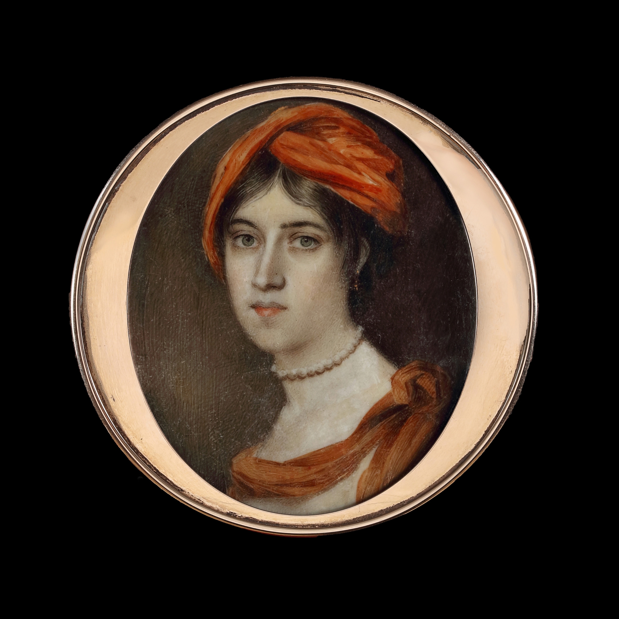 Portrait miniature of a Lady, wearing a rust-coloured turban and matching shawl, a pearl choker and a white dress
